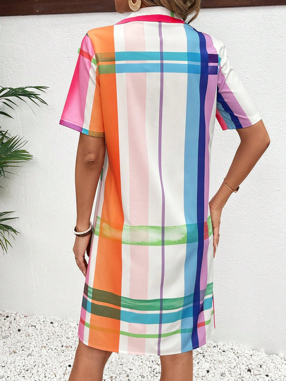 This Summer Vibes: Colorful Plaid Button Front Shirt Dress is the perfect addition to your summer wardrobe. With its vibrant plaid pattern, button-up front, and breathable fabric, it's both stylish and comfortable. Enjoy the sunny days in style with this versatile and trendy dress.