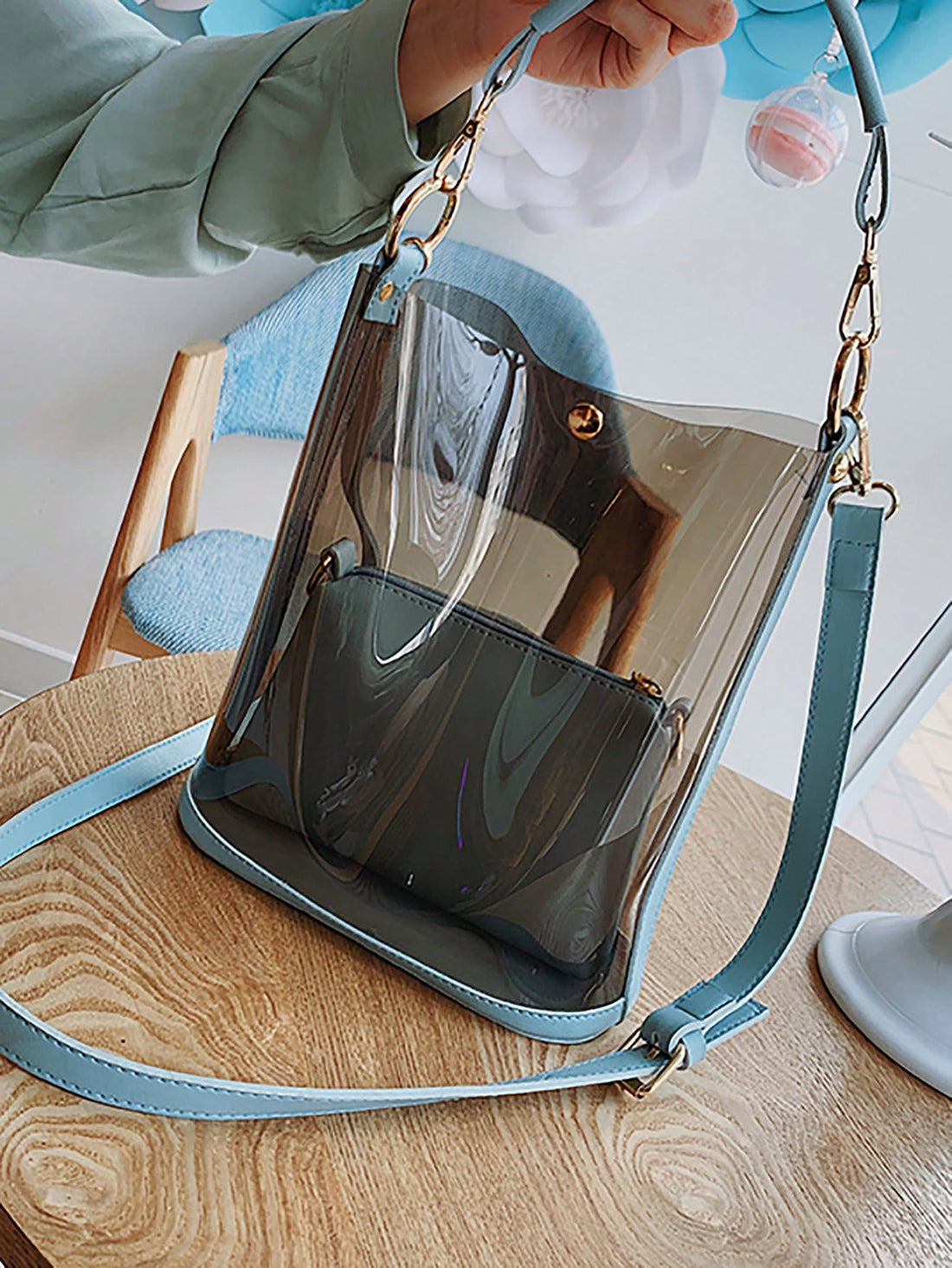 This Summer Chic Clear Jelly Handbag is perfect for any beach-goer. Its clear design gives it a trendy look while the jelly material makes it waterproof and easy to clean. With a spacious interior and comfortable shoulder straps, it's the ultimate beach-ready accessory.