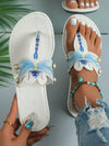 These Dragonfly Delight flip-flop sandals bring a touch of sophistication to your summer style with faux pearl accents. The dragonfly design adds a whimsical touch to any outfit. Made with high-quality materials for lasting comfort. Perfect for any fashion-forward woman looking for a stylish and unique sandal option.