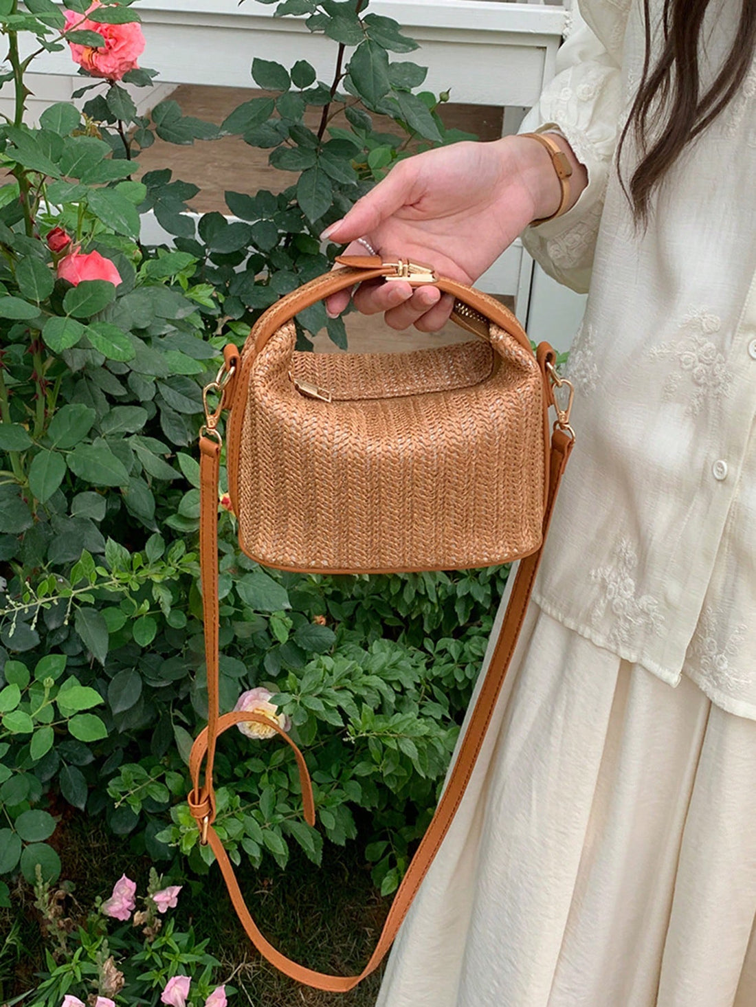 Introducing the Summer Romance Straw Beach Bag - the perfect companion for your summer adventures. With its large capacity, you'll never have to leave anything behind. The crossbody design allows for hands-free convenience. This stylish bag is made of durable straw and is perfect for a day at the beach or a casual outing. Make a statement with the Summer Romance Straw Beach Bag.