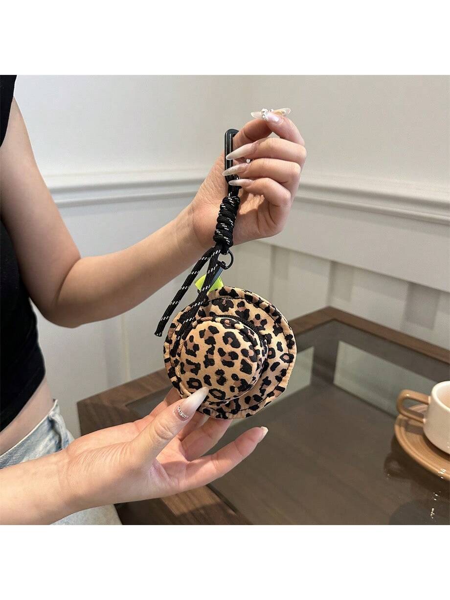 This stylish key bag, designed in the shape of a hat, provides convenient and portable storage for keys. Its candy colors add a touch of fun and playfulness to the design. Keep your keys organized and easily accessible while on the go.