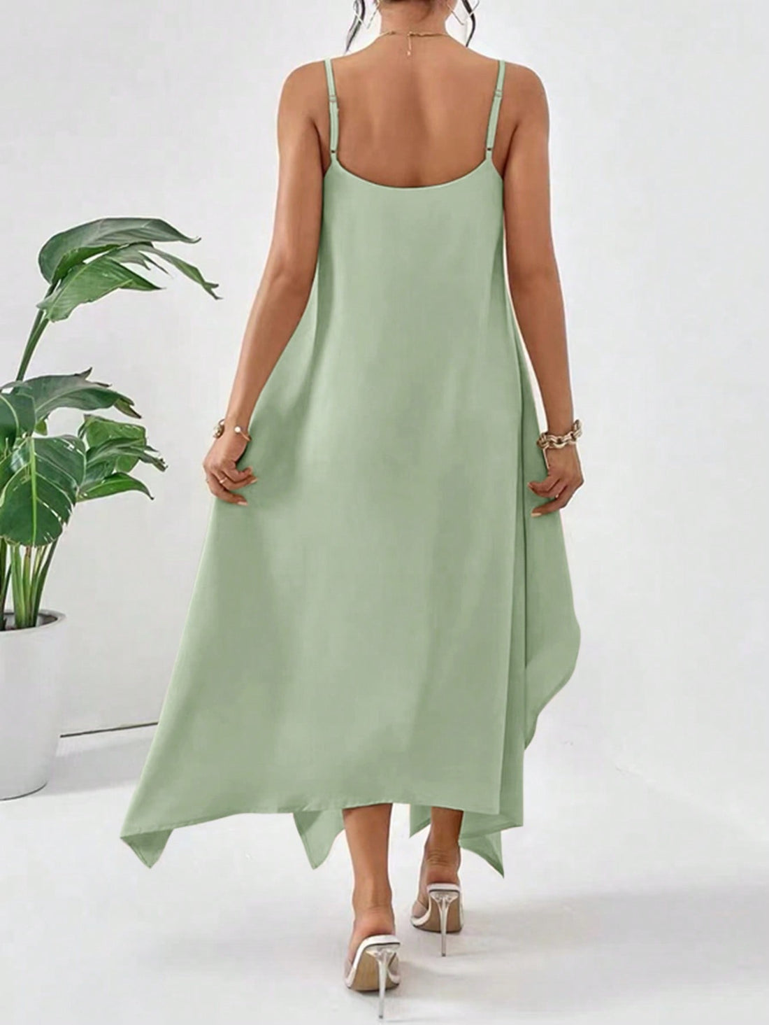 Tap into your inner fashionista with our Mint Green Essence Dress. This simple yet stylish summer dress features a loose fit and an asymmetric hemline, adding a unique touch to your wardrobe. Made with high-quality material, this dress offers both comfort and style for any occasion.