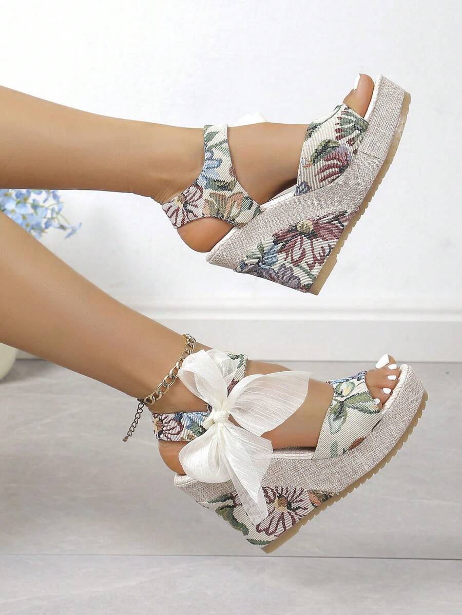 Elevate your warm-weather wardrobe with these charming European-inspired platform wedge sandals. Featuring a delicate ribbon bow detail and open peep-toe design, they blend bohemian elegance with everyday comfort. The canvas upper and PU leather lining provide breathable support, while the TPR outsole ensures reliable traction on any surface. True-to-size fit in a sophisticated mint green hue. Perfect for beach days, casual outings, weddings, or festive occasions