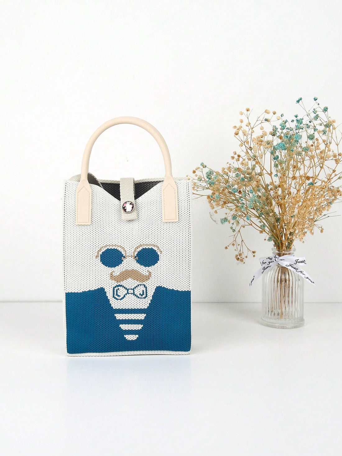 Effortlessly transition from summer to winter with our versatile White Knitted Foldable Handbag. Its lightweight design makes it perfect for any season, while its spacious interior and elegant design make it suitable for any occasion. Stay stylish and organized with this must-have accessory.