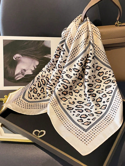 Introducing the ultimate fashion accessory: the versatile leopard print bandana scarf. This must-have piece can be styled in endless ways, adding a touch of wild elegance to any outfit. Made from high-quality material, it ensures both style and comfort. Stand out and make a statement with this unique and versatile accessory.