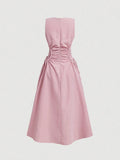 Back view of blush pink fit and flare dress with zipper