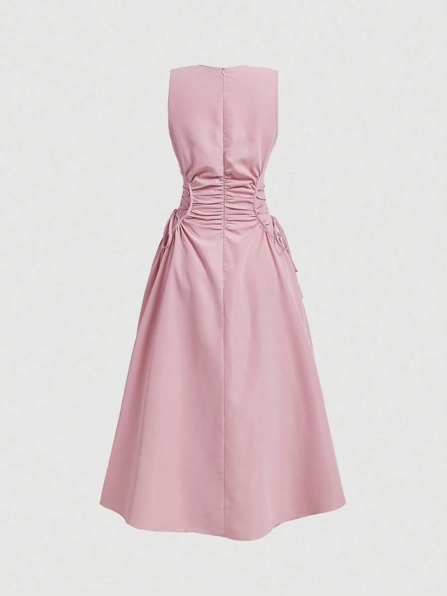 Back view of blush pink fit and flare dress with zipper