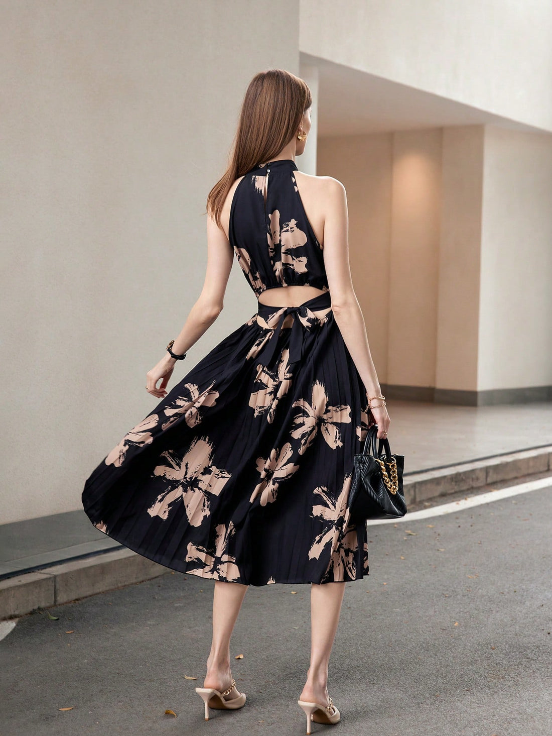 Slay the fashion game with this elegant and playful strappy sleeveless dress! Featuring a printed hem and waist belt, this unique dress will make you stand out in any crowd. Perfect for any occasion, it's versatile and stylish. Don't miss out on this quirky yet trendy addition to your wardrobe.