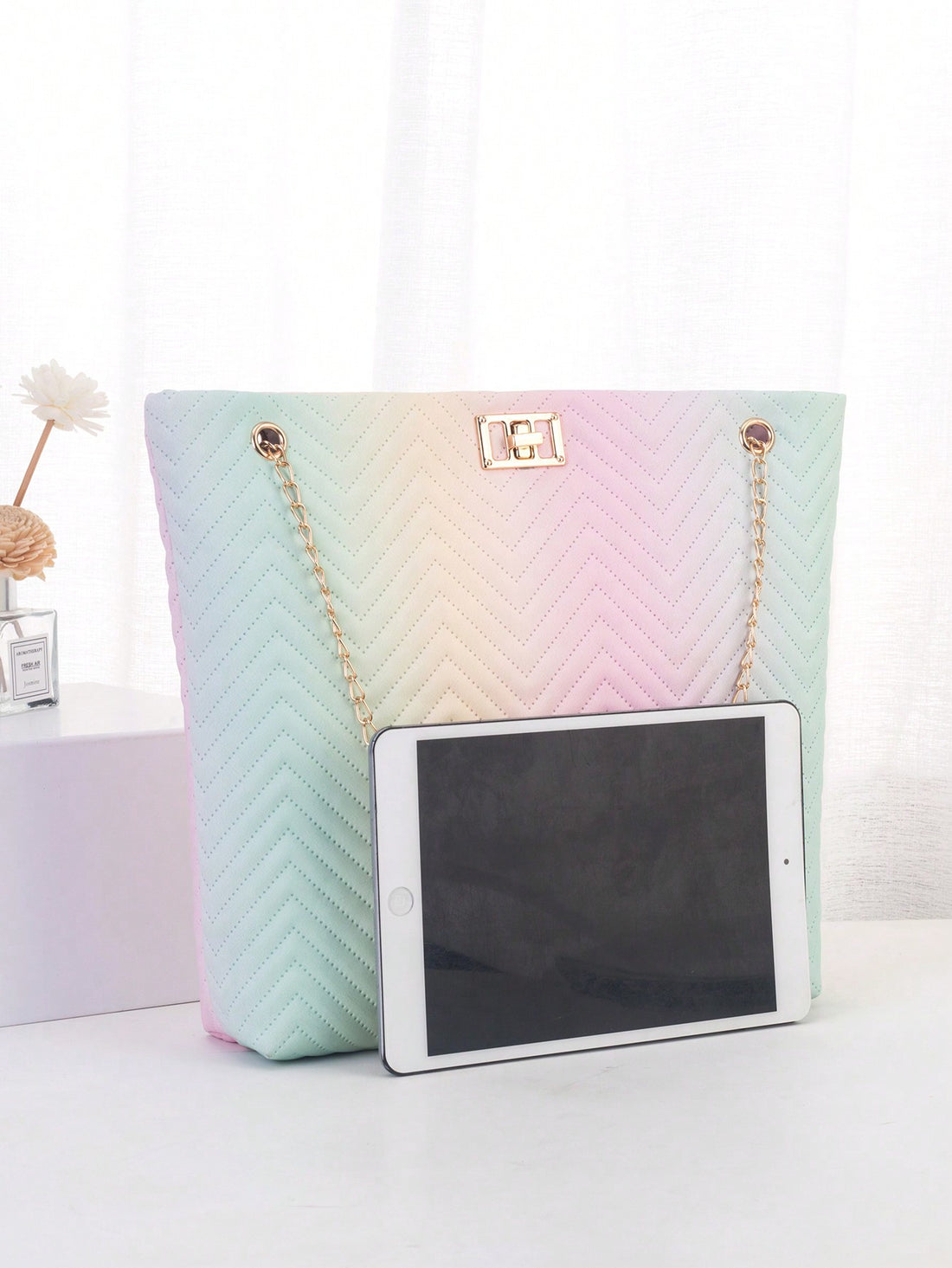 The Geometric Color Collision Shoulder Tote combines style and function for the perfect summer accessory. With its unique geometric design and vibrant color palette, this tote is sure to turn heads. Its spacious interior and comfortable shoulder straps make it ideal for everyday use.