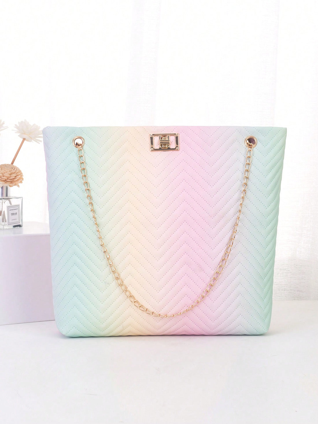 The Geometric Color Collision Shoulder Tote combines style and function for the perfect summer accessory. With its unique geometric design and vibrant color palette, this tote is sure to turn heads. Its spacious interior and comfortable shoulder straps make it ideal for everyday use.