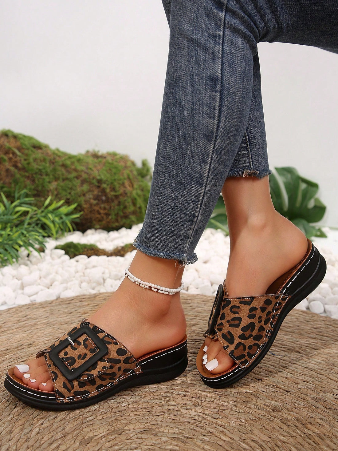 Add a fierce statement to your summer wardrobe with our Wildly Chic Leopard Print Wedge Sandals. Made for outdoor adventures, these sandals offer a comfortable and stylish design to keep your feet supported all day long. Perfect for any occasion, upgrade your summer look with a touch of wildness.