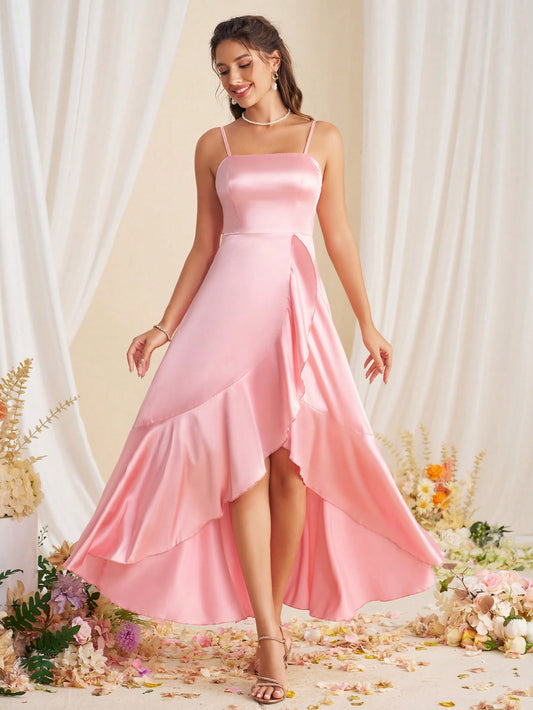 Effortlessly exude elegance and sophistication in our Chic and Sophisticated Asymmetric Hem Halter Bridesmaid Dress. With its unique asymmetrical hem and flattering halter neckline, this dress is the perfect choice for any formal occasion. Make a statement without trying too hard.