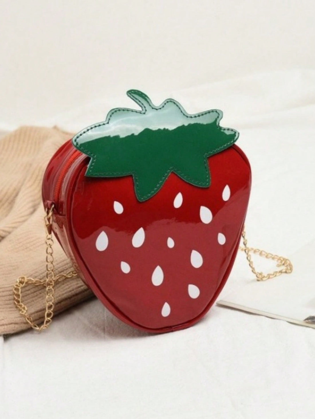 Unleash your little one's style with our Cartoon Strawberry Crossbody Bag! This fashionable and lightweight gift for girls features a cute strawberry design, perfect for any young trendsetter. Crafted with high-quality materials, it's durable and stylish. Treat your daughter to a fun and practical accessory she'll love!
