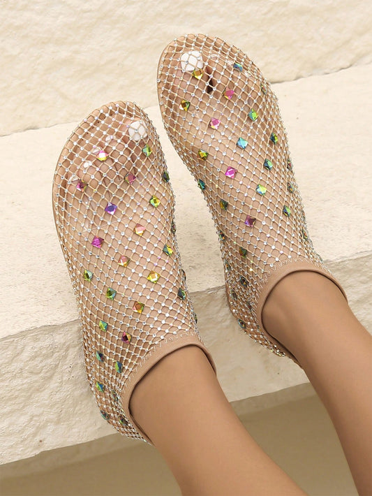 Step into style and comfort with our Rainbow Candy Color Rhinestone Flat Sandals. These slip-ons feature a vibrant rainbow color scheme and sparkling rhinestone details, perfect for adding a pop of personality to any outfit. With their comfy fit and versatile design, they're the perfect sandals for every season.