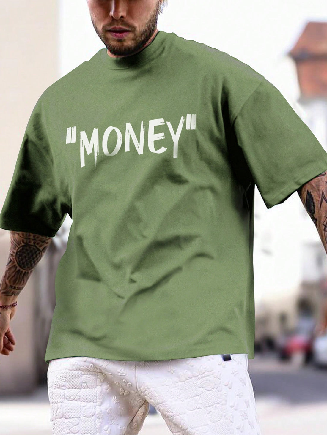 This men's mint green t-shirt features a unique skull letter print, making it a must-have for summer. Made with high-quality materials, this shirt offers comfort and style. Stay on-trend with this casual and cool addition to your wardrobe.