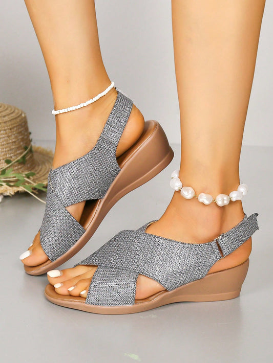 Elevate your beach vacation wardrobe with our Sleek and Stylish Silver Buckle Strap Wedge Sandals. Combining fashion and functionality, these sandals provide all-day comfort for strolling along the shore. The silver buckle adds a touch of sophistication to these must-have summer essentials