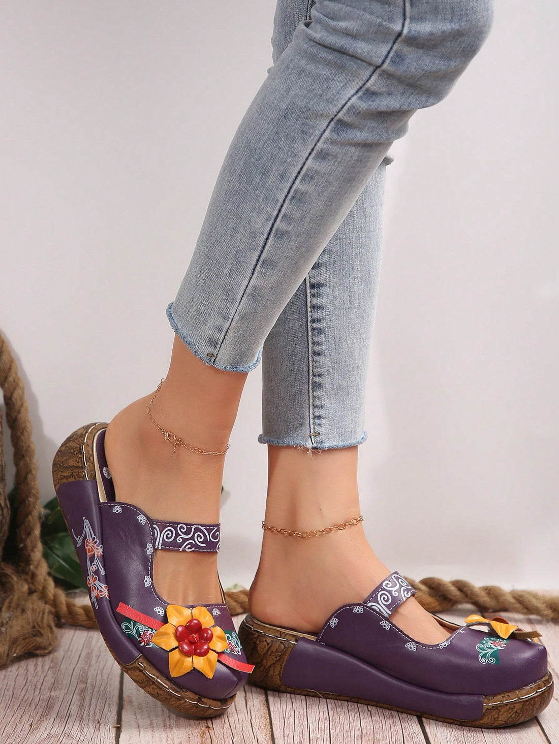 Elevate your style with our Floral Fantasy Women's Wedge Mule Sandals. These beautiful sandals feature a floral decor that adds a touch of elegance to any outfit. The wedged heel provides stability and comfort, making them perfect for all-day wear. Step into fashion with these versatile and stylish sandals.