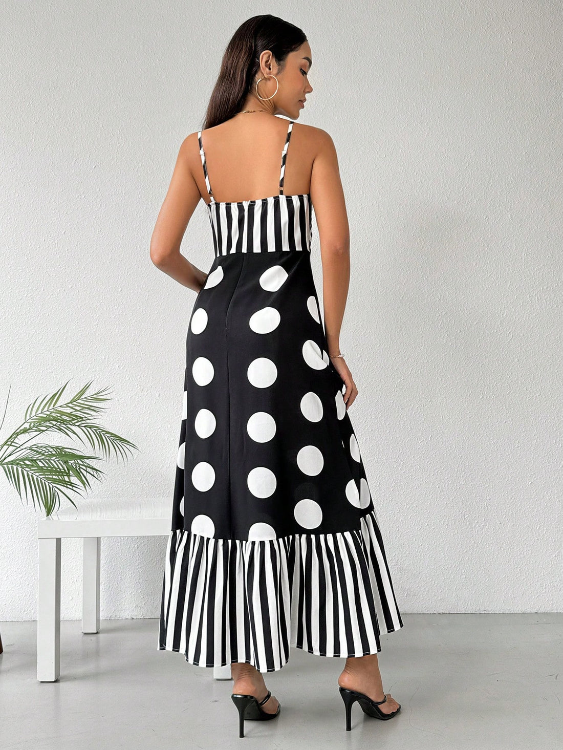 Embrace Parisian vibes with our Chic French-Style Cami Dress! Featuring striped and polka dot splicing, this dress adds a playful twist to the classic cami style. Perfect for spring and summer, this dress will have you looking effortlessly stylish. Bonjour, fashionista!