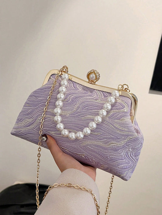 This chic handbag is the ultimate evening accessory, boasting a stylish purple gradient moire print. Its sleek design and premium materials make it the perfect complement to any elegant outfit. Elevate your style with this sophisticated and versatile purse.
