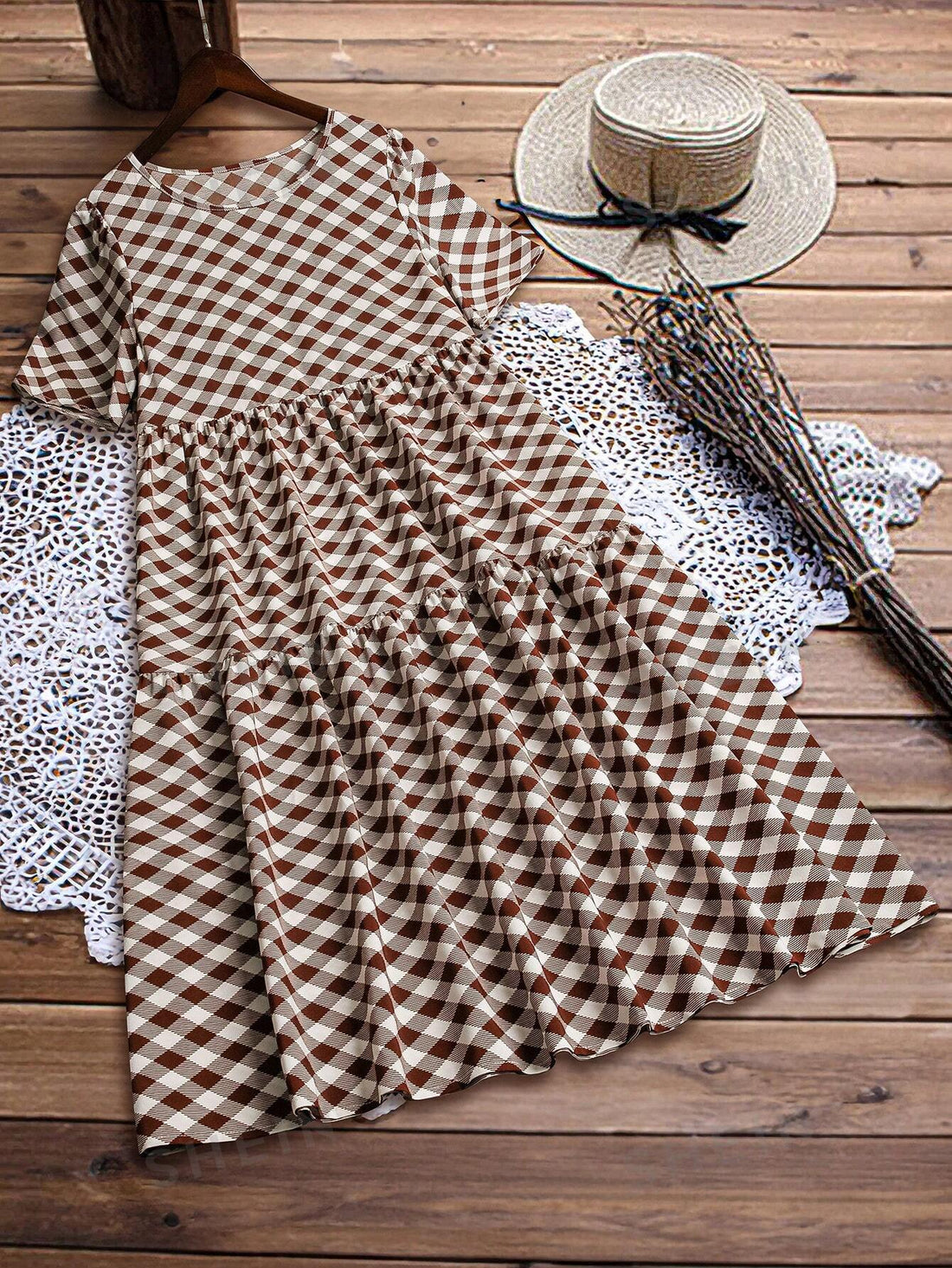 Get ready for the ultimate summer look with our Gingham Ruffle Hem Maxi Dress. This chic, casual dress features a classic gingham print and a ruffle hem for a touch of feminine flair. Stay cool and stylish all summer long in this must-have dress.