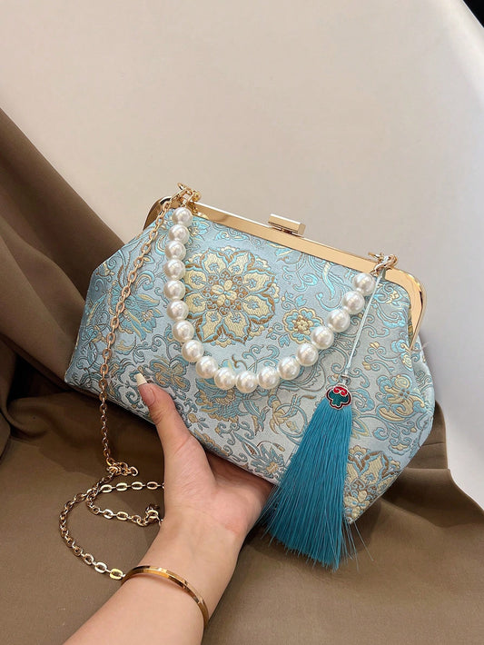 Add an elegant touch to any evening outfit with our Pearl-Adorned Blue Embroidered Handbag. The perfect accessory for parties and special occasions, this handbag features beautiful pearl embellishments and intricate embroidery. Elevate your style and make a statement with this ultimate evening accessory.