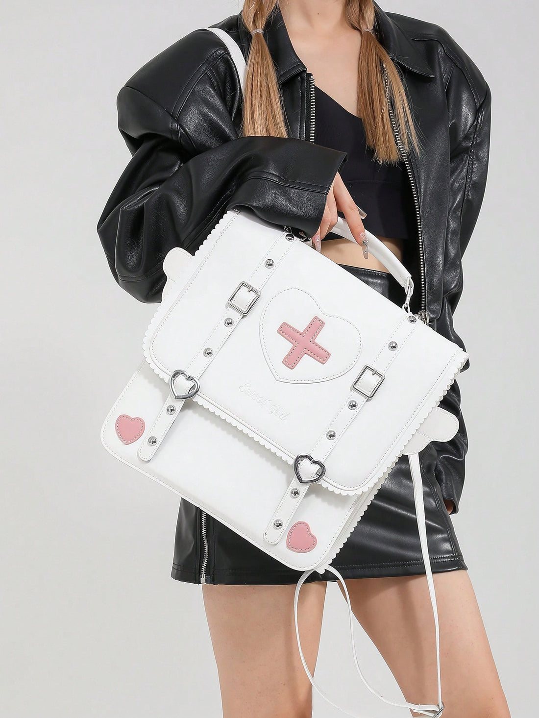 Introducing the Kawaii Angel Wings Backpack - your ultimate goth rock punk flap handbag! Embrace your edgy style with this unique and trendy backpack, complete with kawaii angel wings for a touch of whimsy. With plenty of space and organization, this backpack is both stylish and functional, making it the perfect accessory for any outfit.