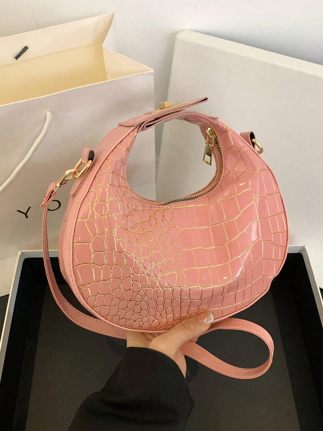 This vintage crescent handbag is perfect for women on-the-go. Featuring a one-zipper design, you can easily access all your belongings while staying stylish. Crafted from high-quality PU material, the woven bag offers durability and a classic look. A must-have accessory for any fashionable woman.