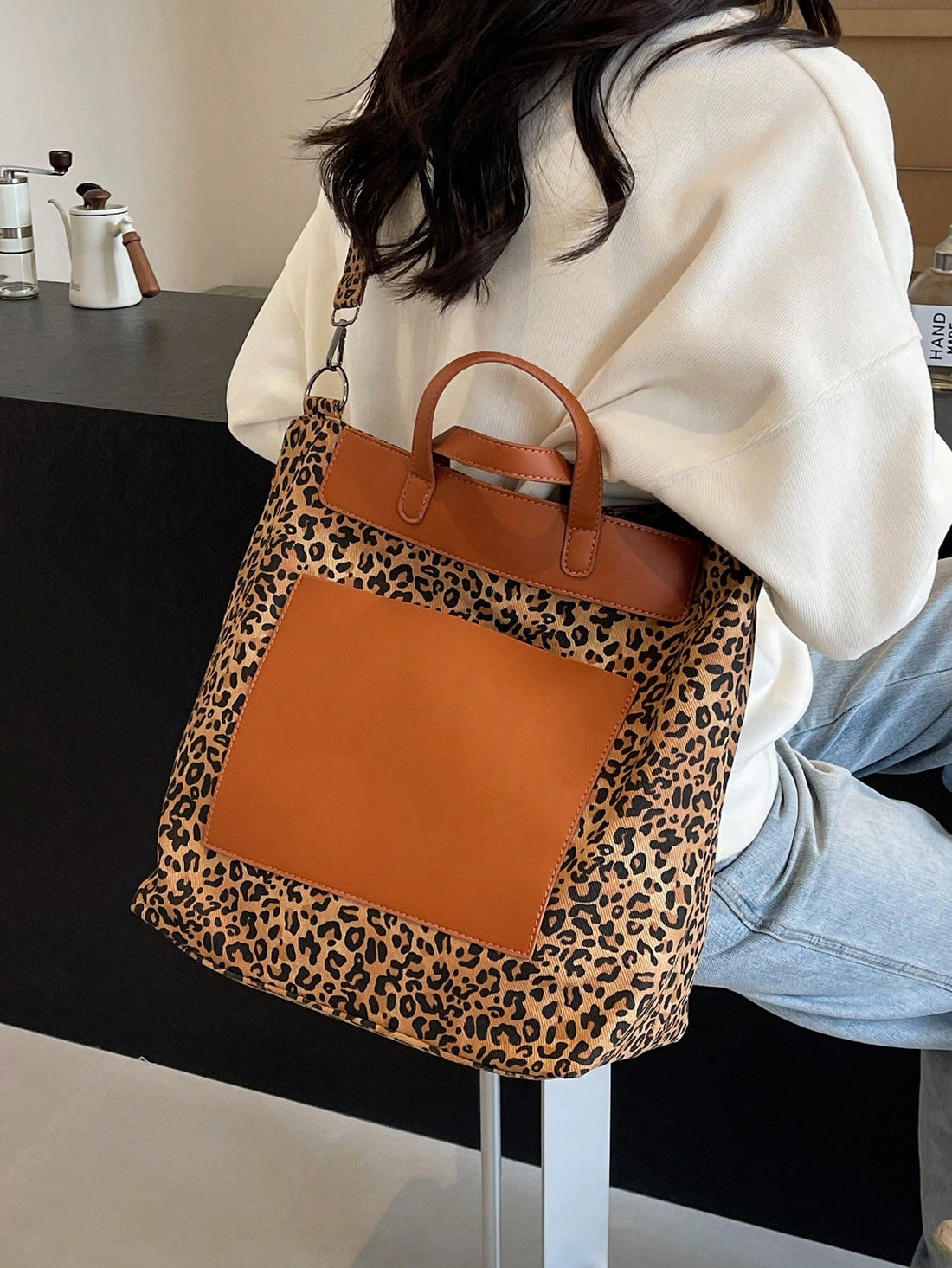 Elevate your style with our Leopard Print Tote Bag. It's not only stylish but also durable, perfect for any occasion. Crafted with versatility in mind, it's the perfect accessory for any outfit. Unleash your wild side with this trendy and functional tote bag.