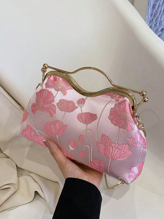 Elevate your style with the Pretty in Pink Lotus evening bag. This fashionable clutch is perfect for parties, weddings, and prom. With elegant lotus details, it adds a touch of sophistication to any outfit. Its compact size makes it perfect for carrying essentials while still being a statement piece.