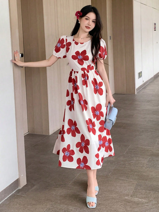 Elevate your wardrobe with our Floral Print Balloon Sleeve Dress. This feminine and flirty piece is a versatile staple that will take you from day to night. With its delicate floral print and playful balloon sleeves, you'll feel confident and stylish in any setting. Perfect for any occasion, this dress is a must-have for any fashion-forward individual.