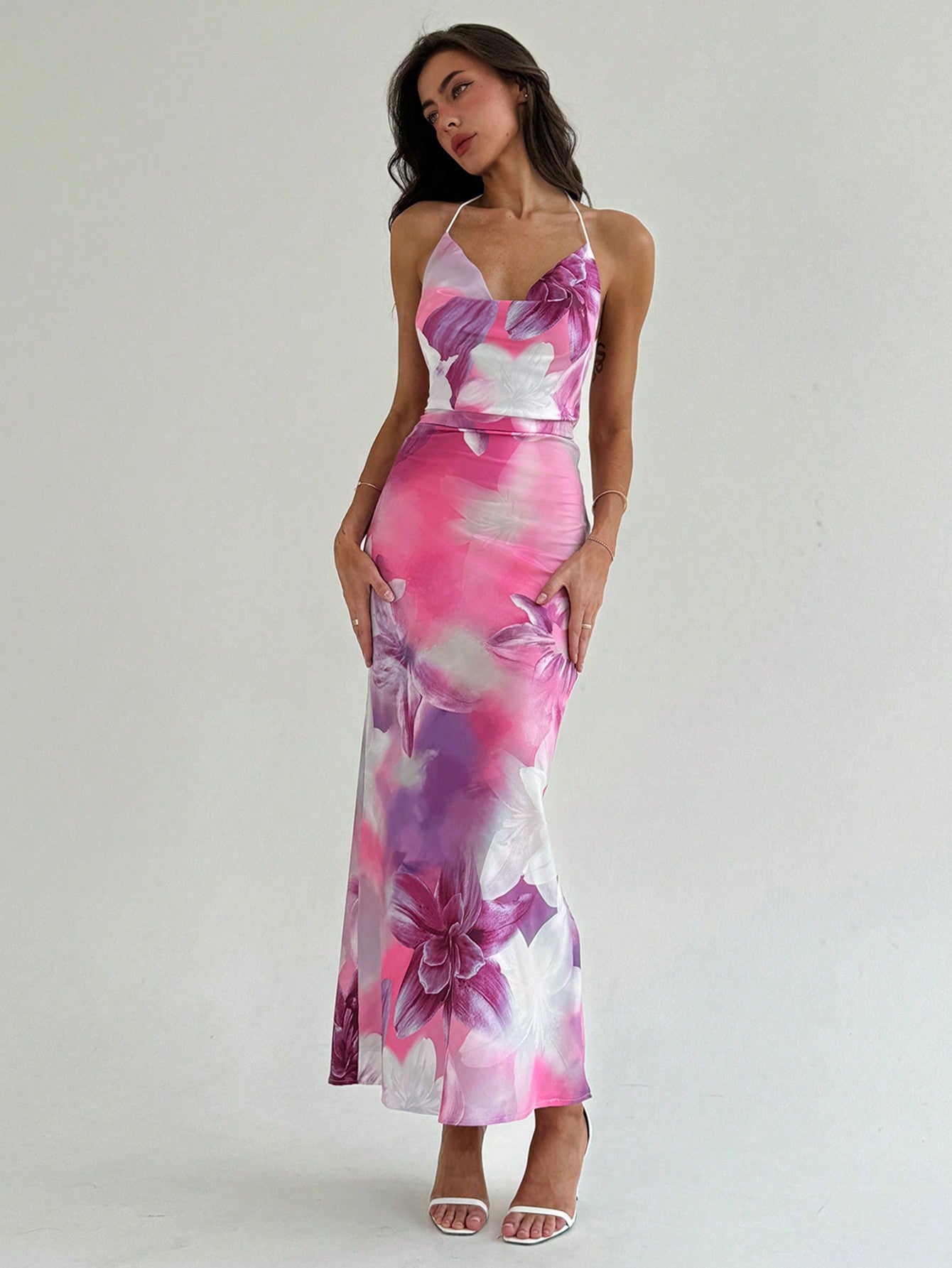 Experience the ultimate in sophistication and style with Floral Elegance: Stunning Cowl Neck Backless Dress. The gorgeous cowl neck design and elegant floral pattern make this dress a true standout. And with its alluring backless feature, you'll feel confident and glamorous for any special occasion.