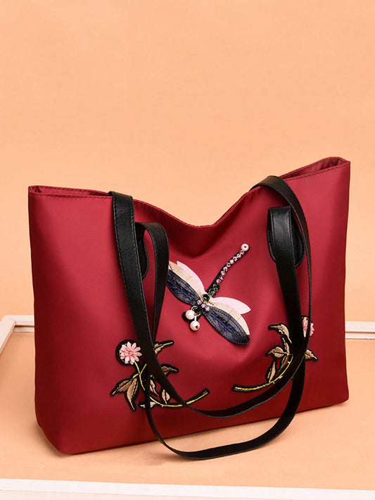 Elevate your everyday style with our Chic and Spacious Solid Color Embroidery Handbag. Crafted with high-quality materials, this handbag offers both fashion and functionality. Its spacious design allows you to carry all your essentials, while the solid color and embroidery add a touch of elegance. Perfect for any occasion, this handbag is an essential addition to your wardrobe.