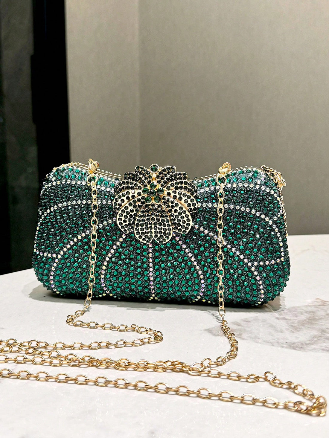 Elevate your evening look with our Elegant Dark Green Rhinestone Clutch. Perfect for special occasions, this clutch is adorned with sparkling rhinestones in a rich dark green hue. With its sleek design and spacious interior, it's the ideal accessory for adding a touch of glamour to any outfit.