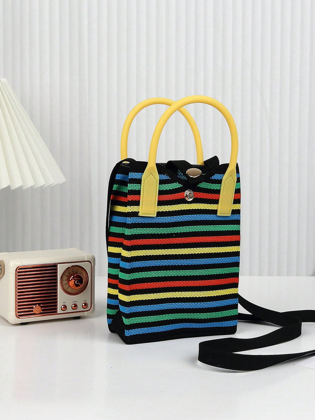 Introducing your perfect companion for all seasons - the Striped Knit Lightweight Ladies Handbag. This durable and stylish handbag features a striped knit design and lightweight material, making it the ideal choice for any weather. Stay fashionable and organized with this must-have handbag.