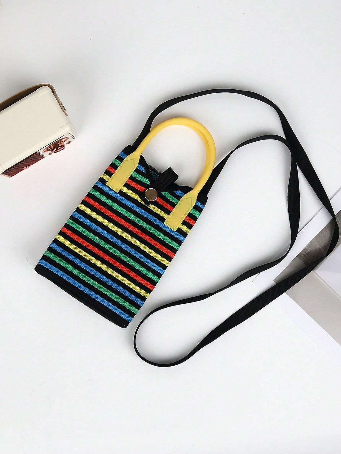 Introducing your perfect companion for all seasons - the Striped Knit Lightweight Ladies Handbag. This durable and stylish handbag features a striped knit design and lightweight material, making it the ideal choice for any weather. Stay fashionable and organized with this must-have handbag.