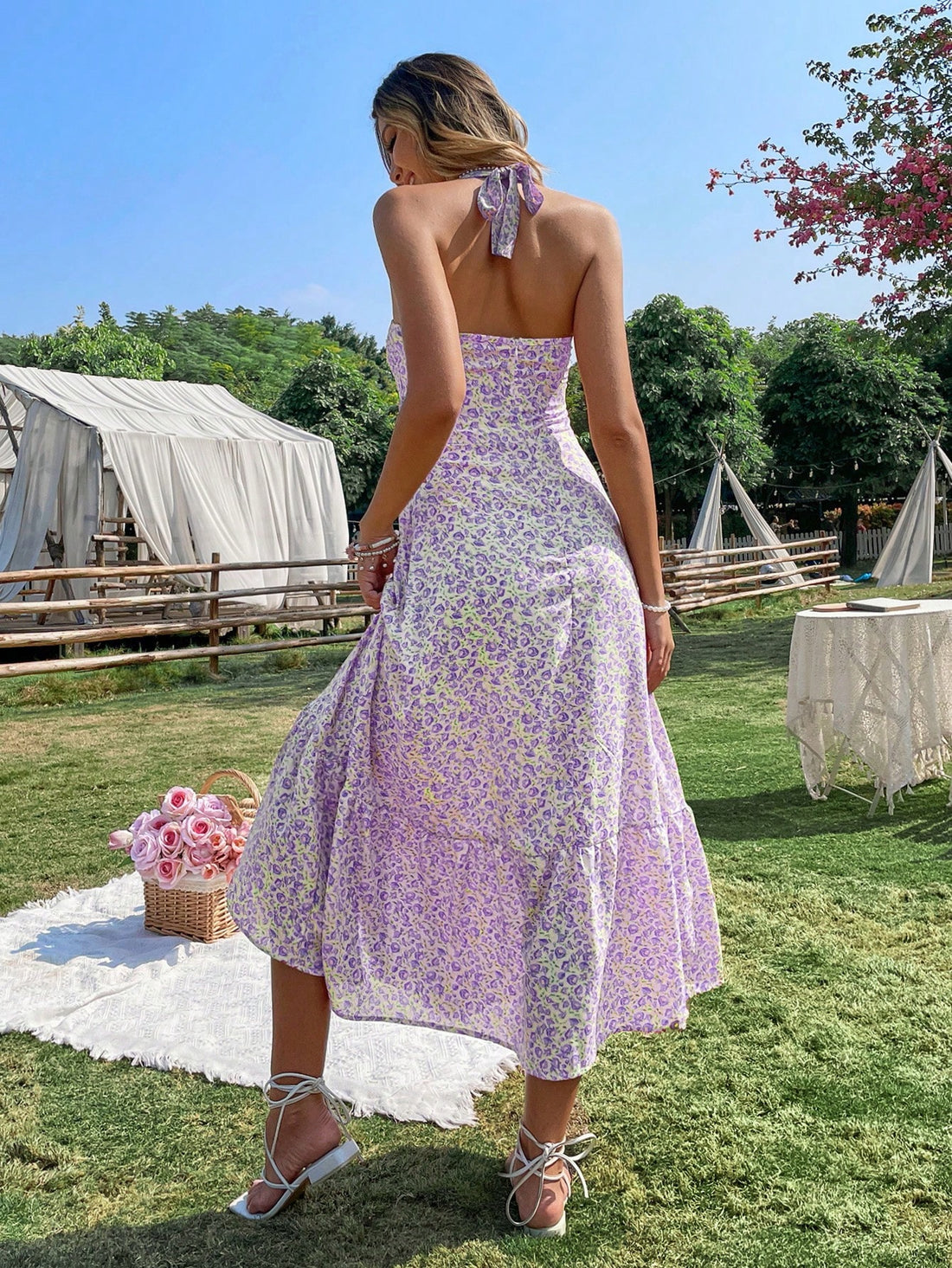 This Blooming Beauty dress features a feminine halter neck and sleeveless design, adorned with a charming floral print. The A-line silhouette flatters the figure and the soft, lightweight fabric ensures comfort. Elevate your wardrobe with this effortlessly elegant dress.