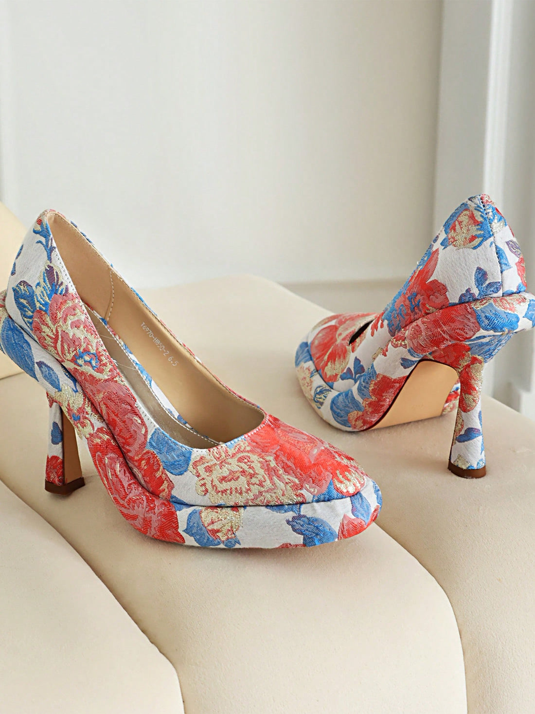 Introducing Floral Fantasy: Women's Stiletto Slip-On Platform Pumps. Elevate your style with these classic stilettos, featuring a slip-on design for easy wear and a platform for added height. The floral print adds a touch of femininity. Perfect for any occasion, these pumps are a must-have for any fashion-forward woman.