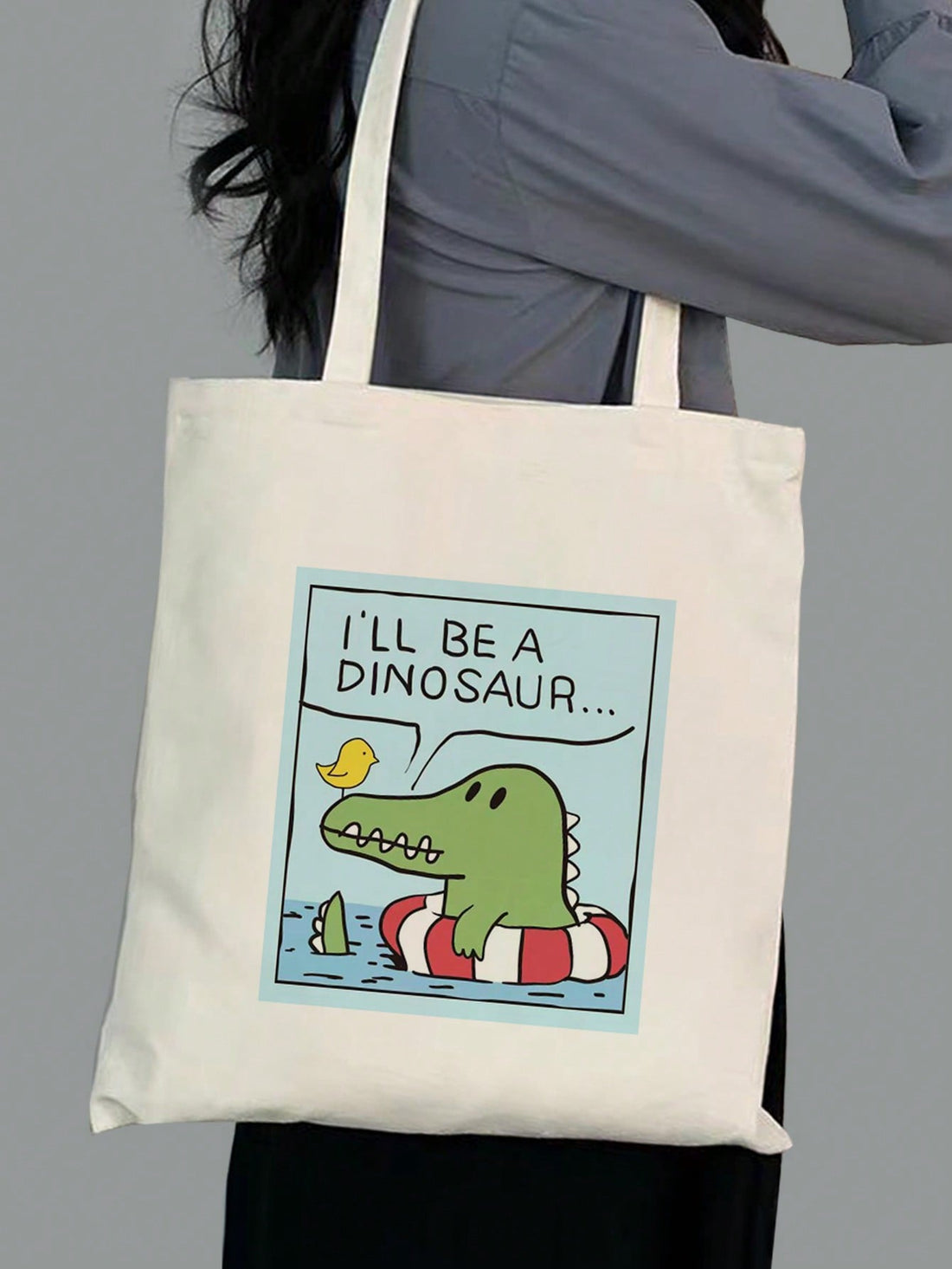 Expertly crafted with a chic canvas material, this shoulder bag boasts a playful print of cartoon birds and crocodiles, perfect for stylish women. With a spacious size and durable straps, this tote not only looks fashionable but also provides functionality for everyday use.
