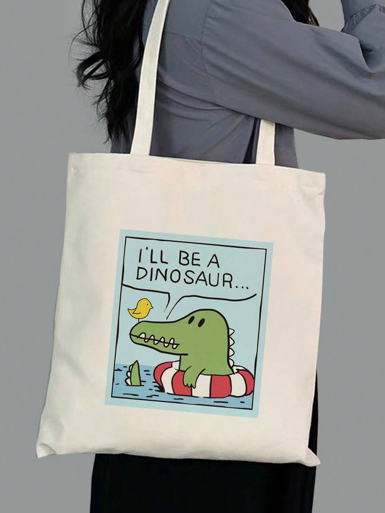 Expertly crafted with a chic canvas material, this shoulder bag boasts a playful print of cartoon birds and crocodiles, perfect for stylish women. With a spacious size and durable straps, this tote not only looks fashionable but also provides functionality for everyday use.