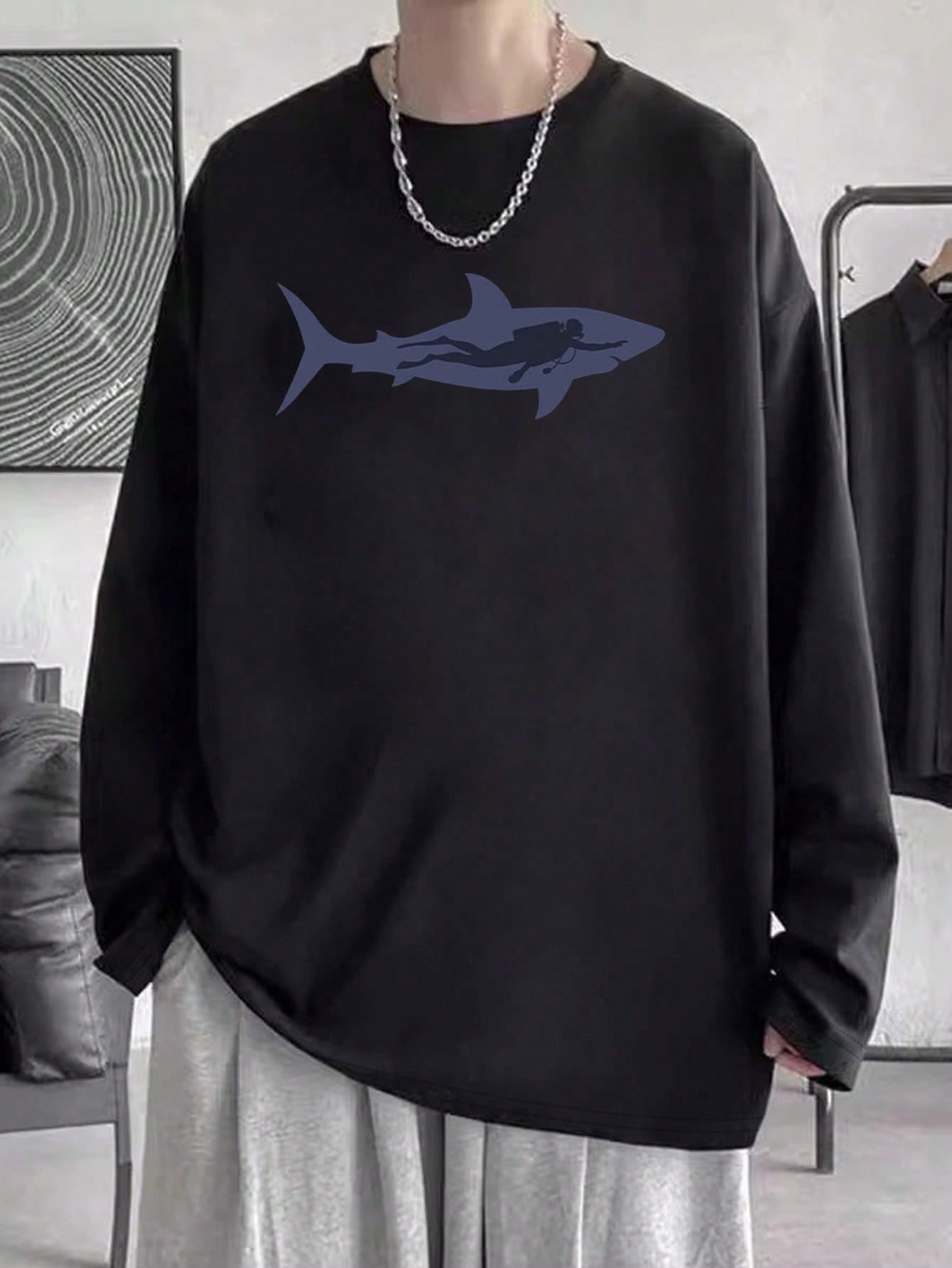 Crafted from soft and comfortable cotton material, this men's t-shirt features a bold and striking shark print. Show off your fierce and stylish side with this unique tee. Perfect for anyone who loves to make a statement with their fashion choices. Available in various sizes for a perfect fit.