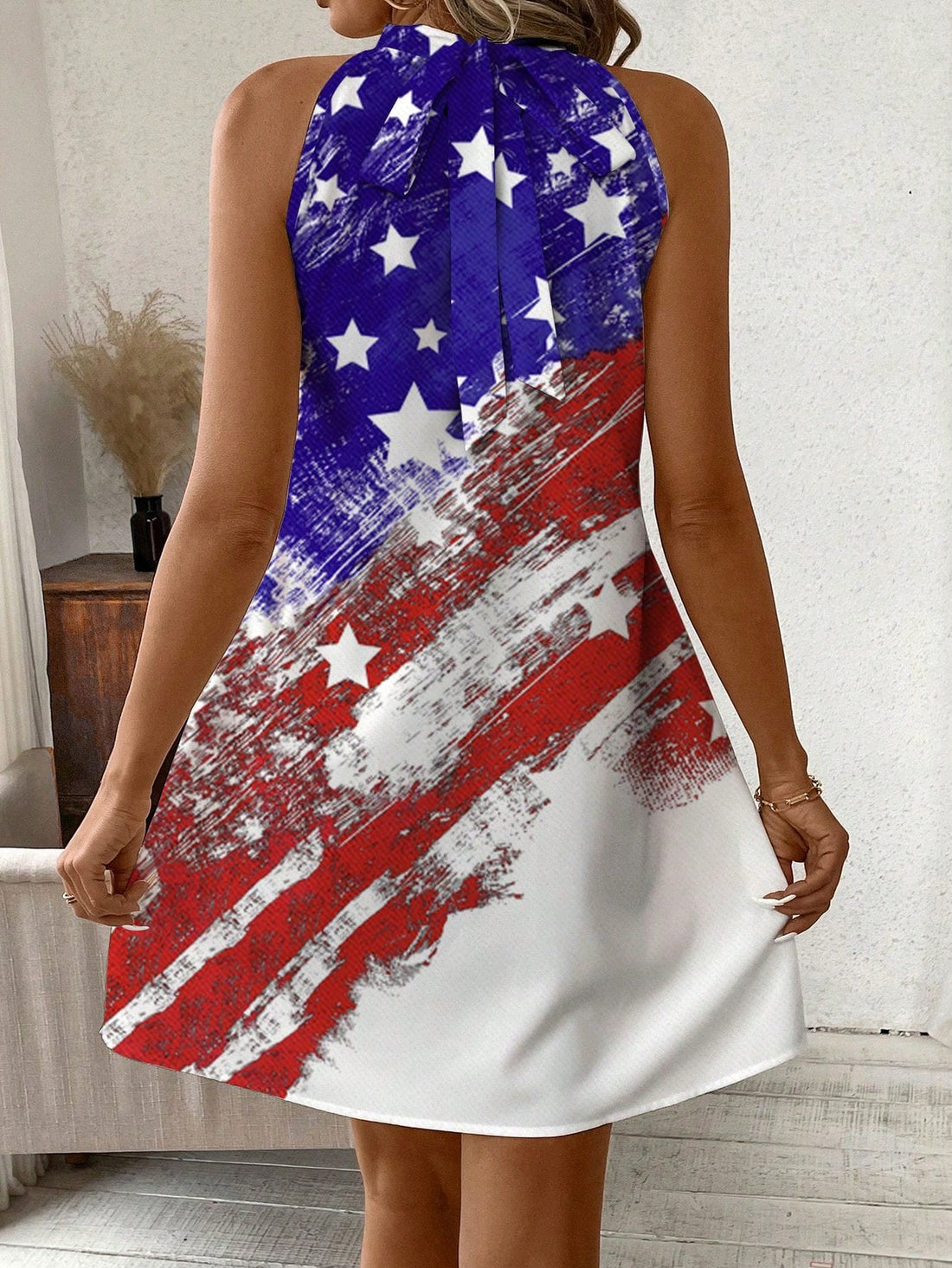 Embrace your American pride with our Classic American Flag Halterneck Dress. Featuring a timeless design, this dress allows you to show your patriotism and stand out in style. Made with high-quality materials, it offers both comfort and durability. Perfect for any occasion, show off your love for your country in this stunning halterneck dress.