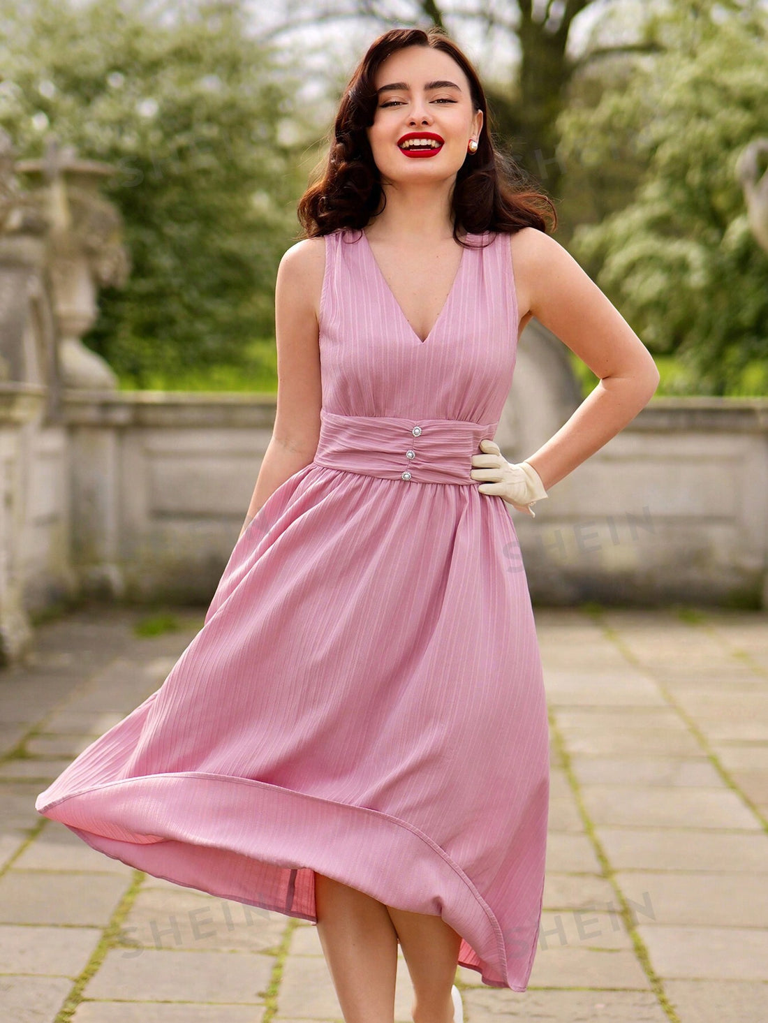 Experience timeless elegance and sophistication with our Vintage Elegance dress. Featuring a charming ruffled V-neckline and sleeveless design, this dress is perfect for special occasions. The vintage-inspired design adds a touch of femininity, while the high-quality fabrics ensure comfort and luxury. Elevate your style and make a statement with this dress.