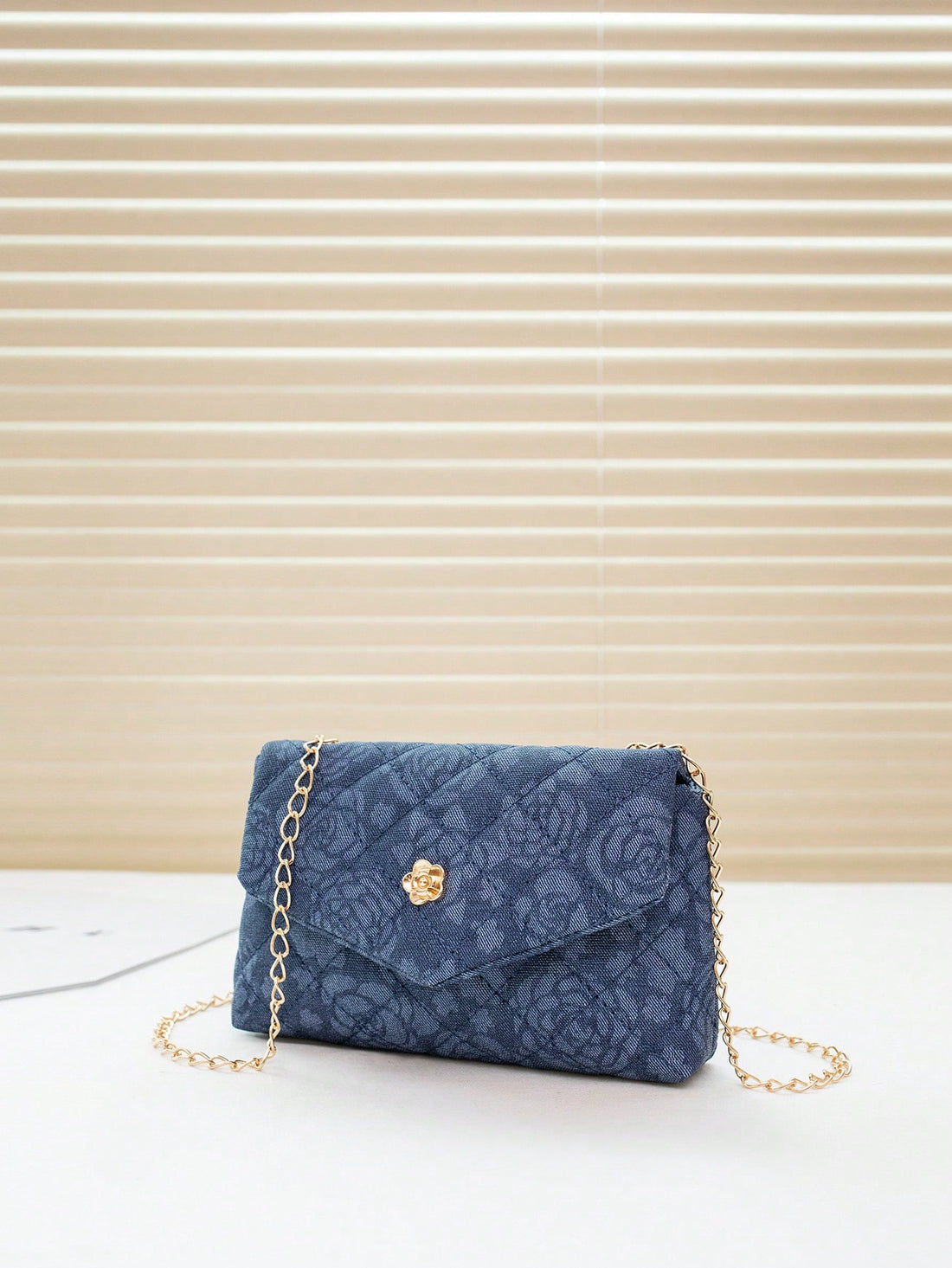 This stylish crossbody bag is the perfect accessory for any fashionable woman. Made from high-quality denim, it offers both durability and style. With its chic flap design, it adds a touch of elegance to any outfit. Stay on-trend and organized with this must-have bag.
