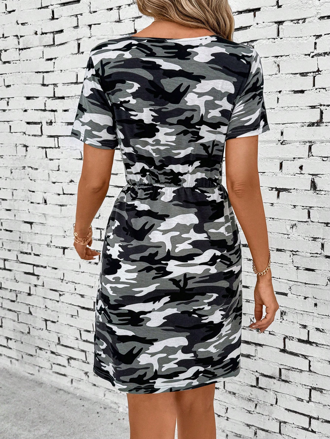 Introducing Camo Chic: the ultimate fashion statement for fierce and playful women. Show off your bold, adventurous side with our Camouflage Printed Short Sleeve Dress. Perfect for any occasion, this dress combines cool and edgy with comfort and style. Get ready to turn heads and embrace your inner fashionista!