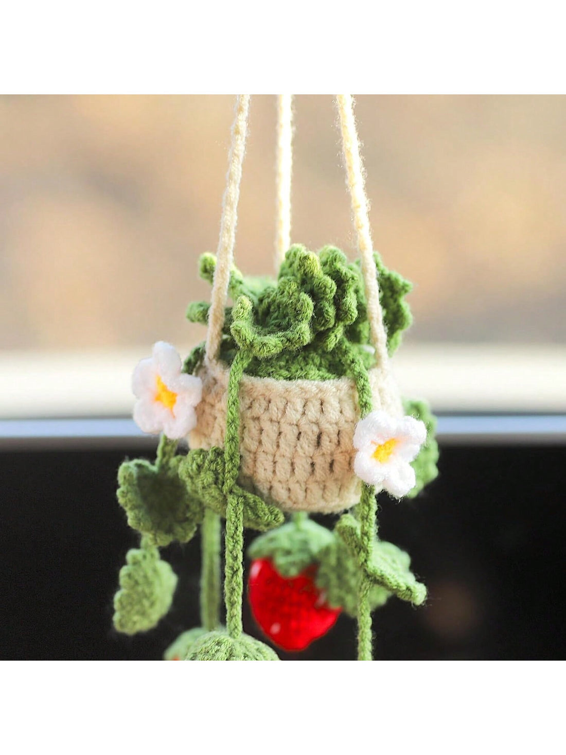 Enhance your car's interior with our Handmade Knitted White Flower Car Mirror Hanging Decoration. Made with care and attention to detail, it adds a touch of charm and personality to your vehicle. The delicate white flower design brings a calming and elegant feel to your daily commute.