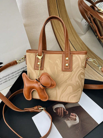 Experience elegance and versatility with our latest handbag. Designed with a fashionable adjustable shoulder strap, this handbag is perfect for any occasion. The perfect blend of style and functionality, this handbag is a must-have for any fashion-forward individual.