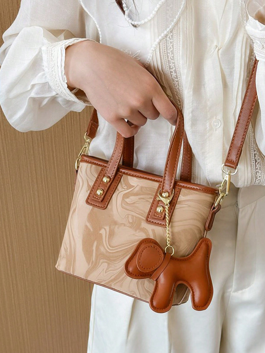 Experience elegance and versatility with our latest handbag. Designed with a fashionable adjustable shoulder strap, this handbag is perfect for any occasion. The perfect blend of style and functionality, this handbag is a must-have for any fashion-forward individual.