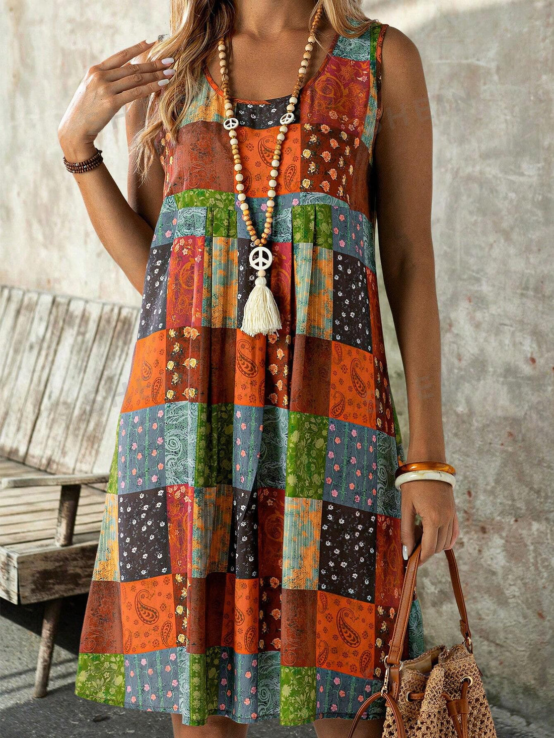 This Women's Patchwork Print Tank Dress is the perfect choice for your summer vacation. The vibrant patchwork print adds a fun and trendy touch, while the tank style keeps you cool and comfortable. Made with high-quality materials, this dress is sure to be your go-to for any sunny destination.