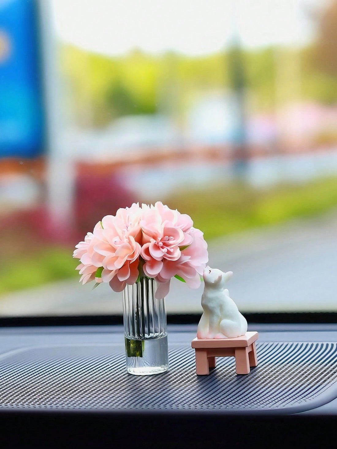 Add a touch of whimsy to your dashboard with Sweet Scents' Flower Cat Car Decoration. This charming accessory not only adds a cute touch to your car, but also infuses a delightful floral scent that will leave your vehicle smelling fresh and inviting.