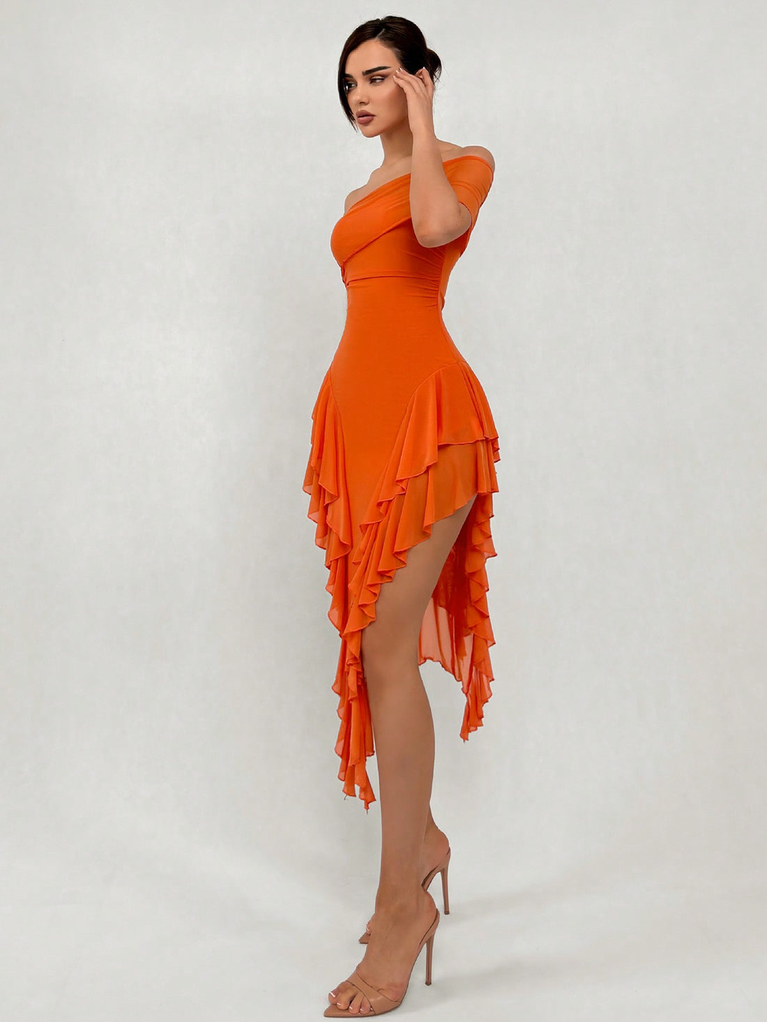 Turn heads on your next romantic outing in this stunning asymmetrical neck long dress. The graceful slit and delicate ruffle details add just the right amount of flirtation, while the elegant silhouette keeps things sophisticated. Perfect for date nights, special occasions, or whenever you want to feel absolutely fabulous. This dress strikes that magical balance between timeless elegance and modern edge—because who says you can't be both classy and playful?